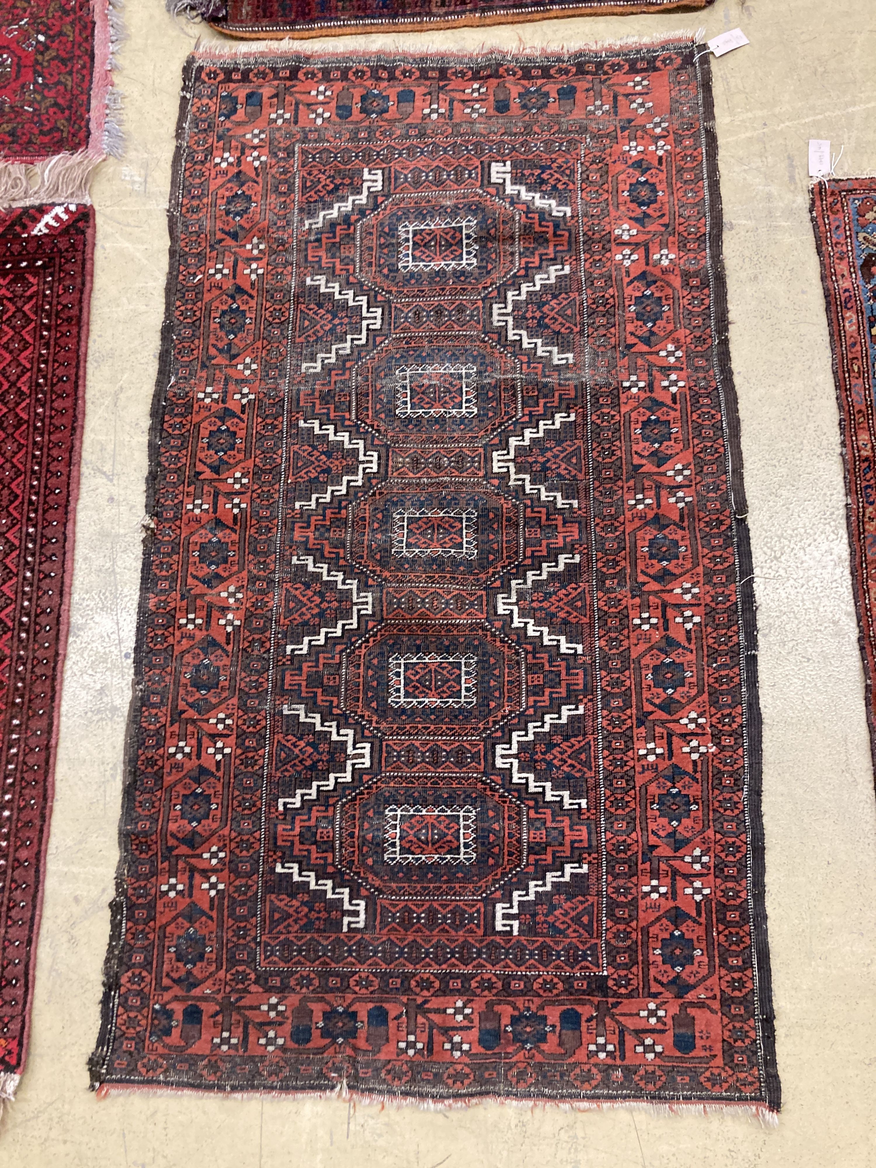 An antique Bokhara rug 170 x 94, Turkoman mat, a Belouch mat and two others.